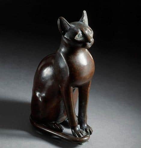 egyptian-goddess-bastet-statue-in-cat-form Figurine of the Egyptian goddess Bastet as a cat